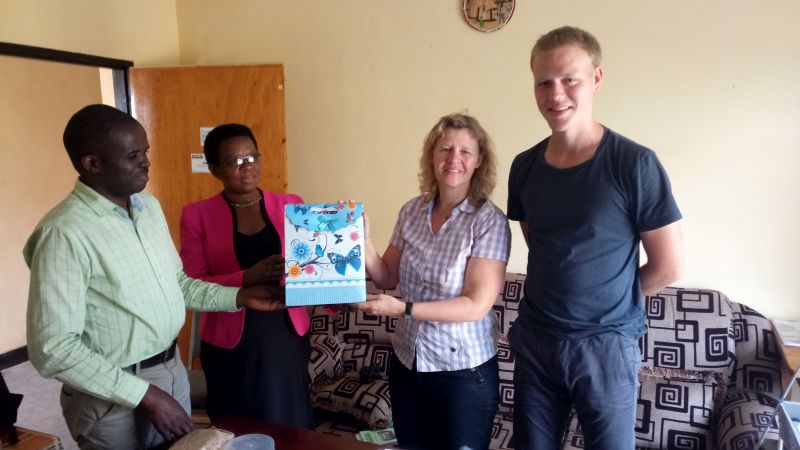 RDIS staff members giving the visitor a small gift as a token of our appreciation